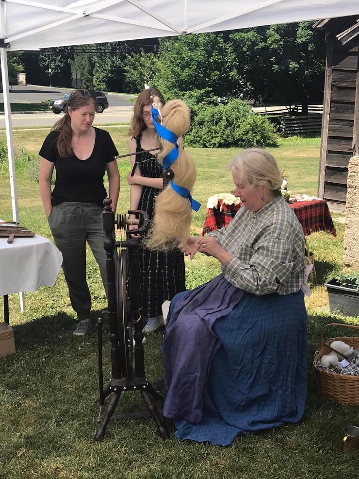 Spinning flax at the Civil War Weekend re-enactment event, July 2022