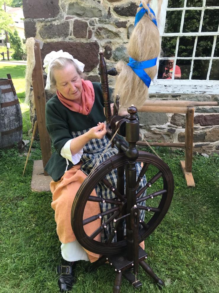 Spinning flax on the 1886 upright Lithuanian spinning wheel.